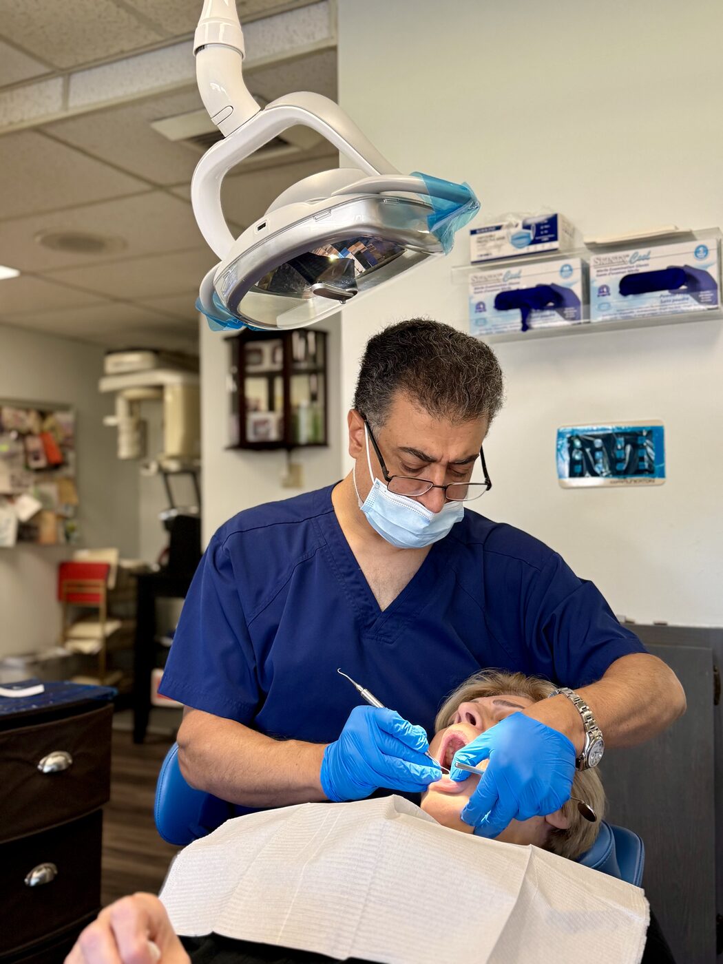 Dr. Rajabi providing gentle care to a patient